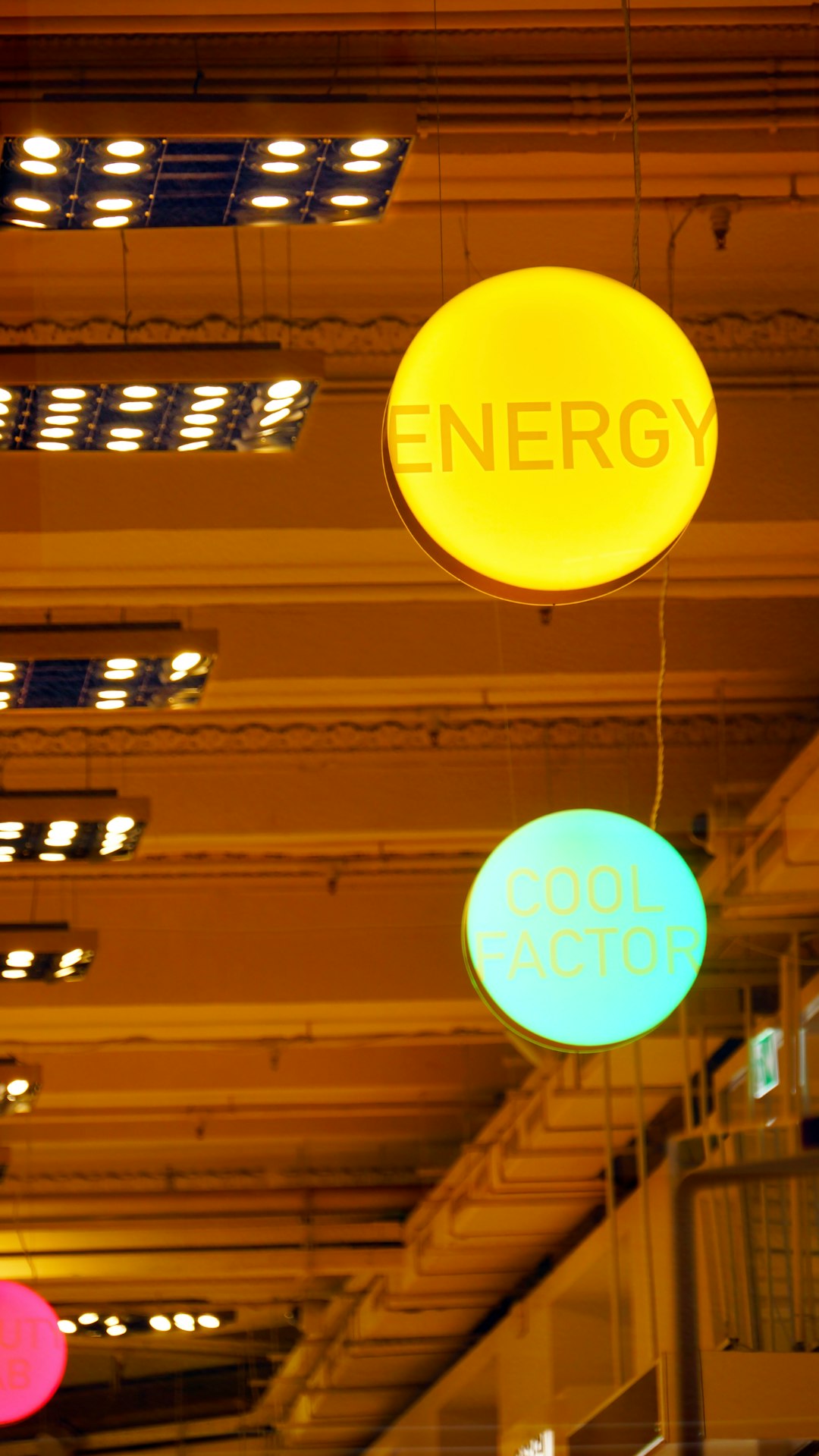 gallery-1 a-group-of-neon-signs-hanging-from-the-ceiling-of-a-building-emmyogmajwa